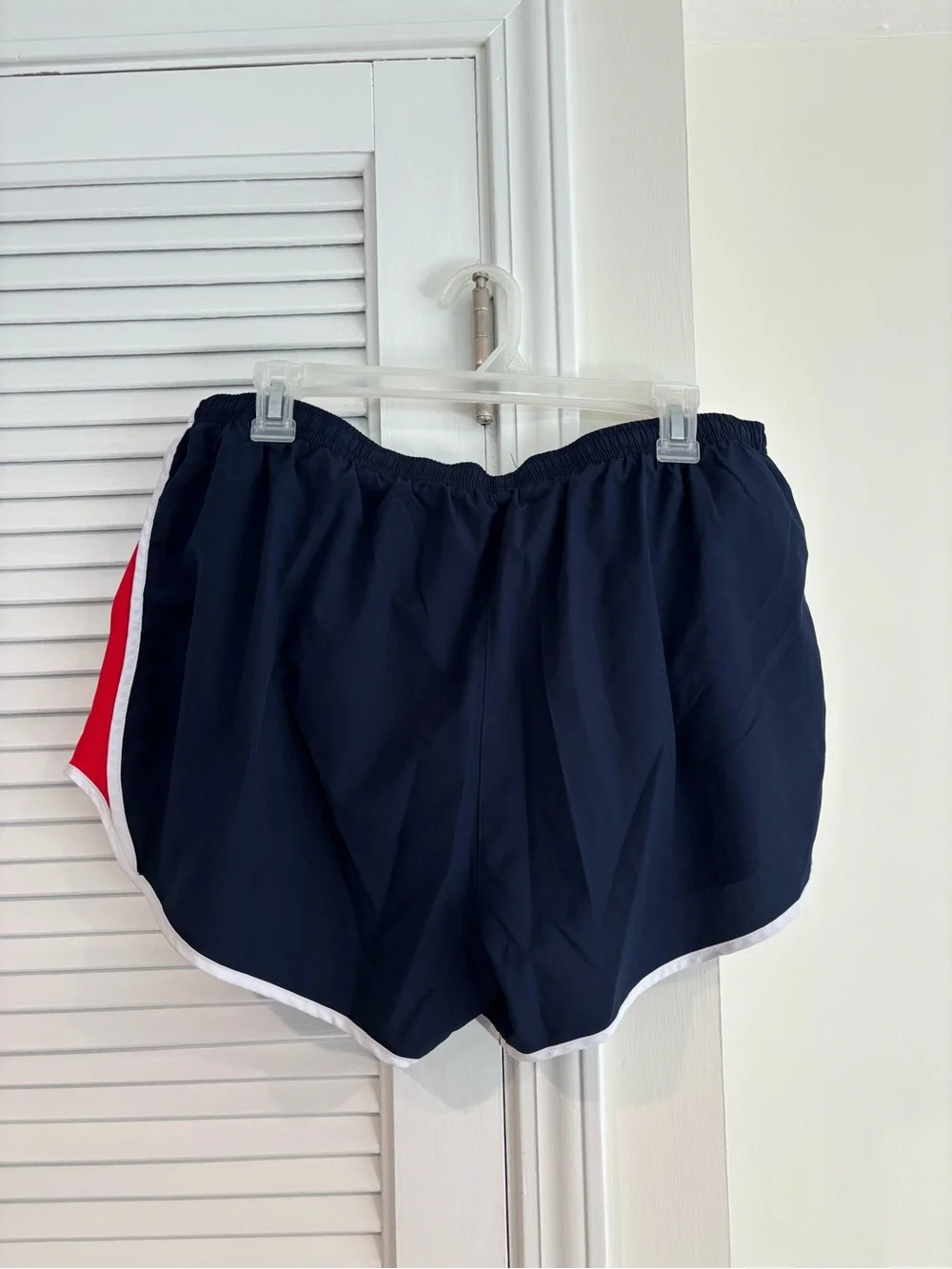 Nike Women's Navy Athletic Shorts with Red and White Trim